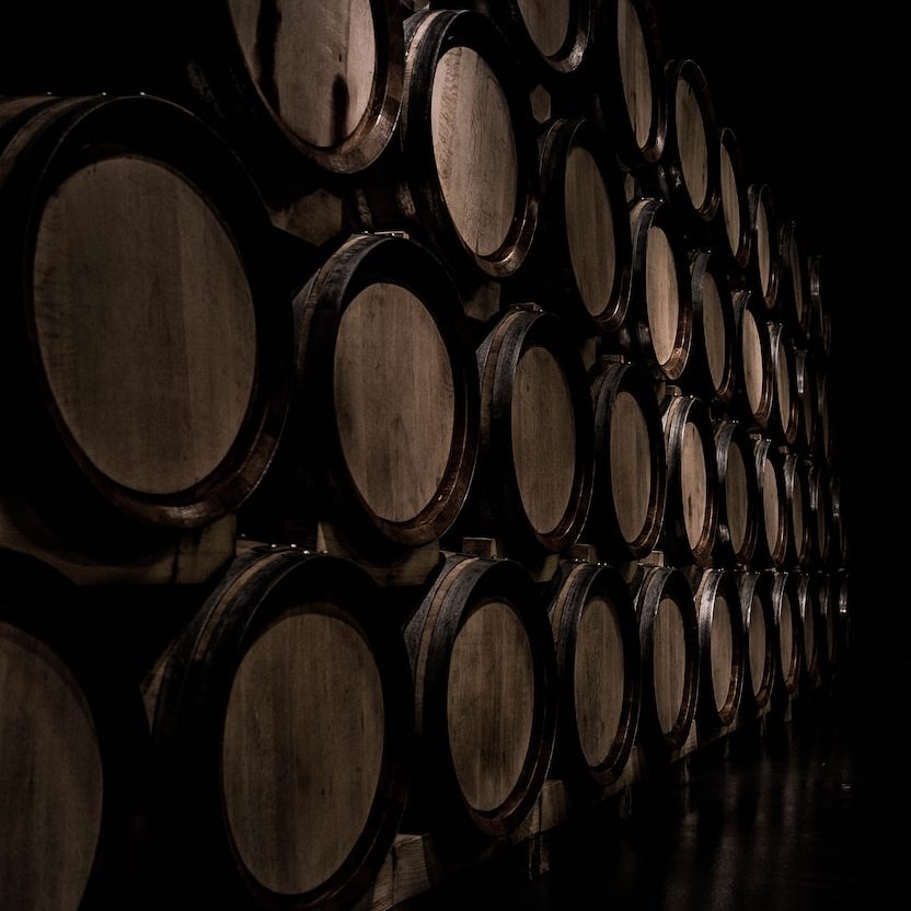 Cellar with stacked wine barrels